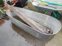 Two 2 man saws and a galvanised bath.