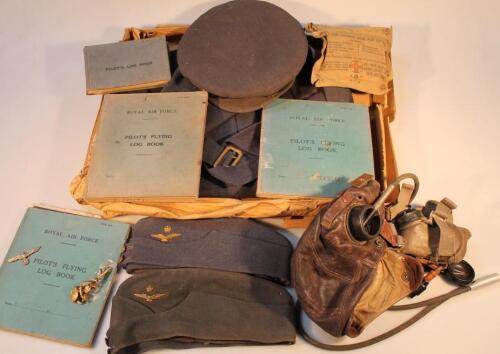 A Second World War RAF leather flying helmet with uniform and log books