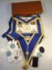 A Masonic apron with sash and other regalia