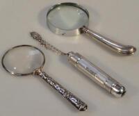 A 1950s silver cased torch and two magnifying glasses