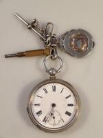 A silver cased fob watch and medallion