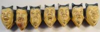 A late 19thC stoneware hanging frieze of seven caricature mask head studies