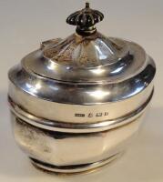 An Edwardian silver oval bombe tea caddy