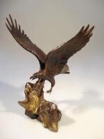 A bronze sculpture of an eagle in flight entitled 'Wings of Glory'