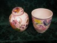 A Poole pattern bowl, polychrome painted in simple flower forms and cockerels,