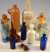 A quantity of stoneware glass and other bottles