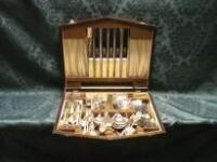 An Arthur Price mahogany canteen containing a part suite of cutlery