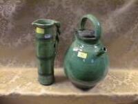 A heavily potted terracotta green glaze flagon