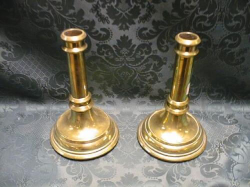 A pair of Victorian brass candlesticks