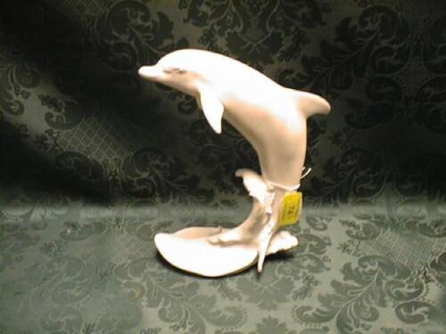 A Kaiser bisque porcelain figure of a dolphin