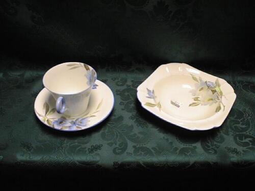 A Shelley tea set, the cups with flared bowls and ring handles, printed