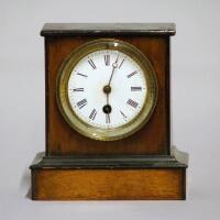 An Edwardian oak cased and part ebonised mantel clock