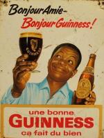 A vintage French Guinness tin advertising sign