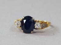 A sapphire and diamond set dress ring