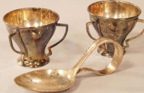 A pair of urn shaped silver salts