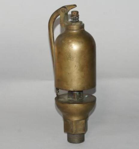 A brass steam train whistle