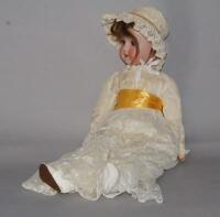 An early 20thC German ceramic and composite doll