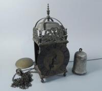 A brass hook and spike lantern clock