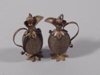 A pair of late 19th/early 20thC Continental gilt metal perfume urns and stoppers