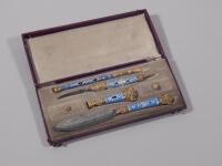 A Continental gilt metal and blue enamelled desk set