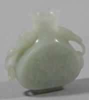 A Chinese pale green jade bottle shaped vase