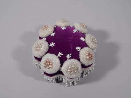 A late 19th/early 20thC beadwork and velvet pin cushion.