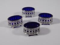 A set of four pierced silver salts