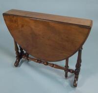 A Victorian walnut Sutherland table