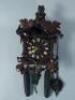 A Black Forest type carved wooden cuckoo clock