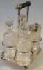 An Edwardian four bottle cruet on stand