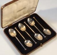 A set of silver spoons of plain form