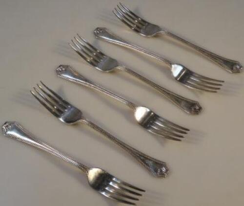 A set of six silver table forks