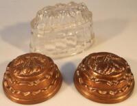 Two copper jelly moulds and another