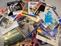 A large quantity of various football programmes