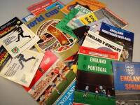 A quantity of international football programmes