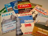 A quantity of football programmes