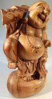 A heavily carved wooden figure of Hotei