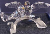 A Swarovski turtle dove figure group