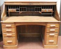 A 1920's oak tambour fronted writing desk