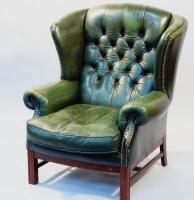 A Chesterfield style leather wingback chair