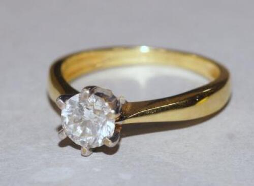 A 18ct gold and 1 carat diamond solitaire ring.