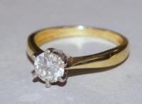 A 18ct gold and 1 carat diamond solitaire ring.