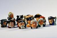 A selection of miniature Royal Doulton character jugs (21).