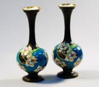 A pair of Phoenix Ware bottle vases