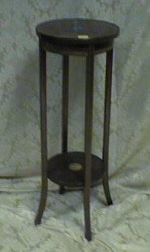 An Edwardian mahogany plant stand