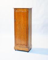 A late Victorian oak pedestal cupboard