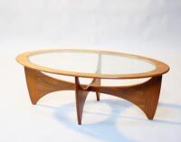 A 1970s teak oval coffee table