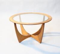 A 1970s circular teak coffee table