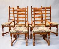 A set of six oak ladder back dining chairs