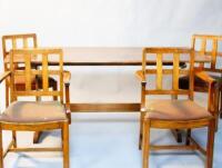 An oak refectory style dining table and six chairs.